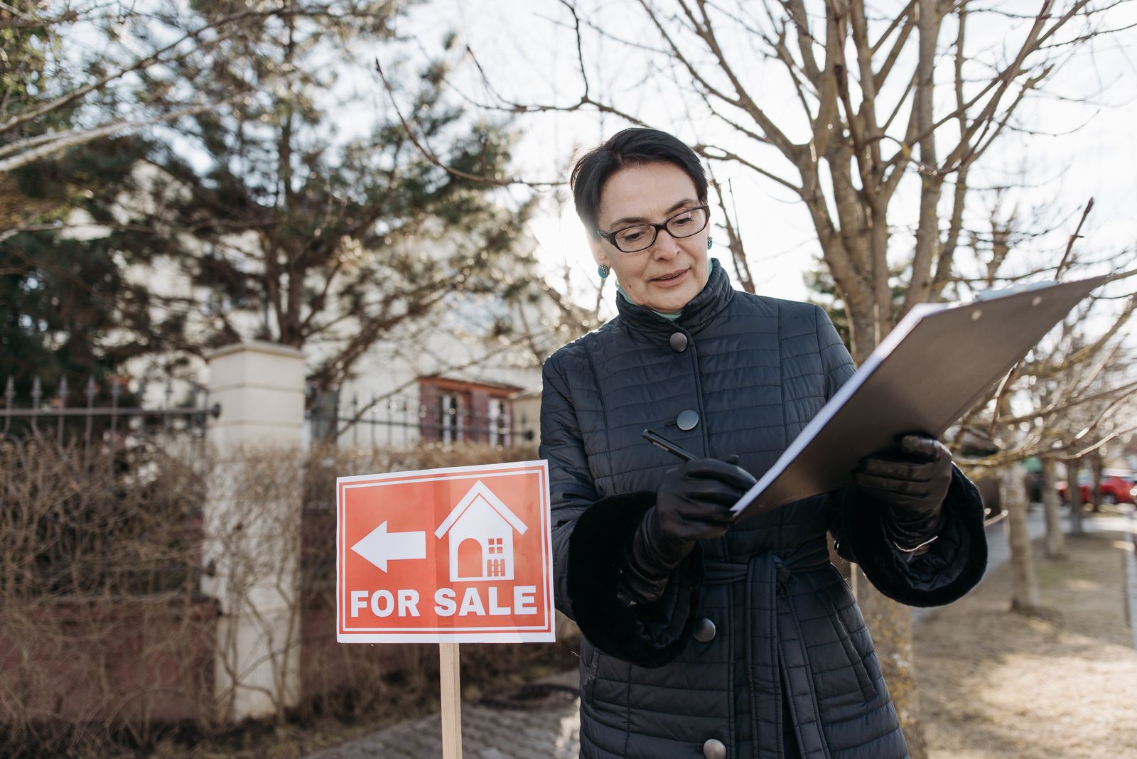 A real estate agent outside a Richmond listing