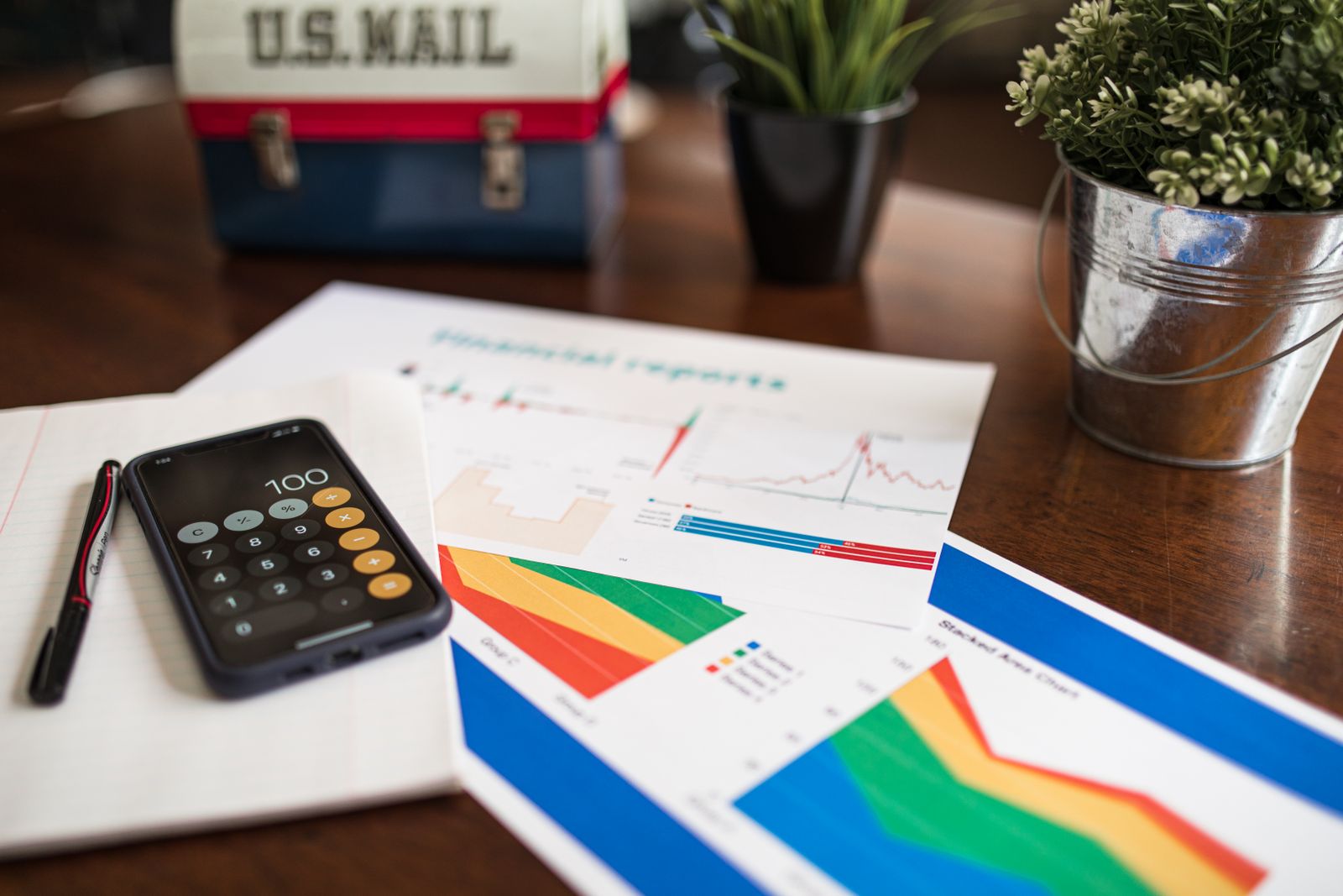 A loan estimate, a calculator and a pen on a desk during a client review